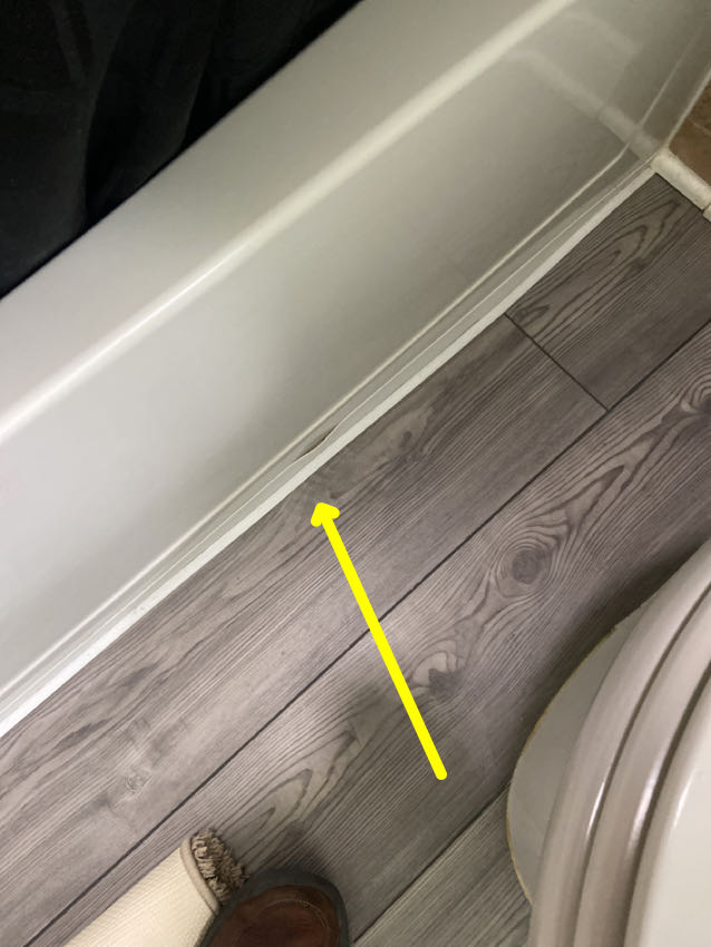 Photo of a Bathtub Water Floor Seal Open Penetration for Water Intrusion