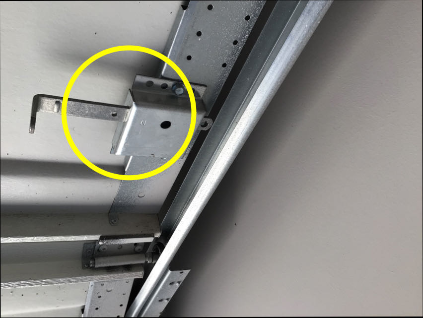Photo of Garage Door Manual Lock not Disabled when Used with Garage Door Opener found on a recent home inspection by Texan Inspection home inspectors.