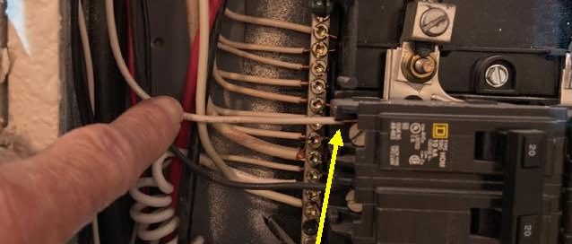 Photo of Neutral Wire Used as a Hot Wire Electrical Panel found in a recent home inspection by Home Inspectors, Texan Inspection.