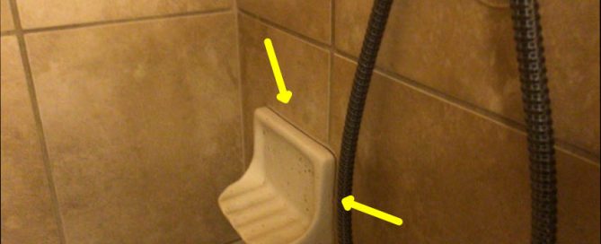 Picture of a soap dish where water is leaking because it is improperly sealed in bathroom shower discovered by Texan Inspection home inspectors.